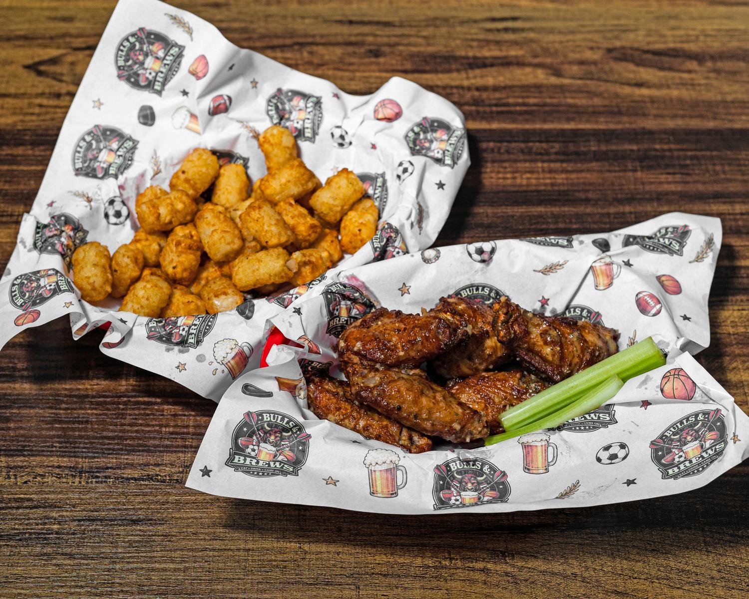 Six chicken wings and a side of tater tots in Bulls & Brews baskets